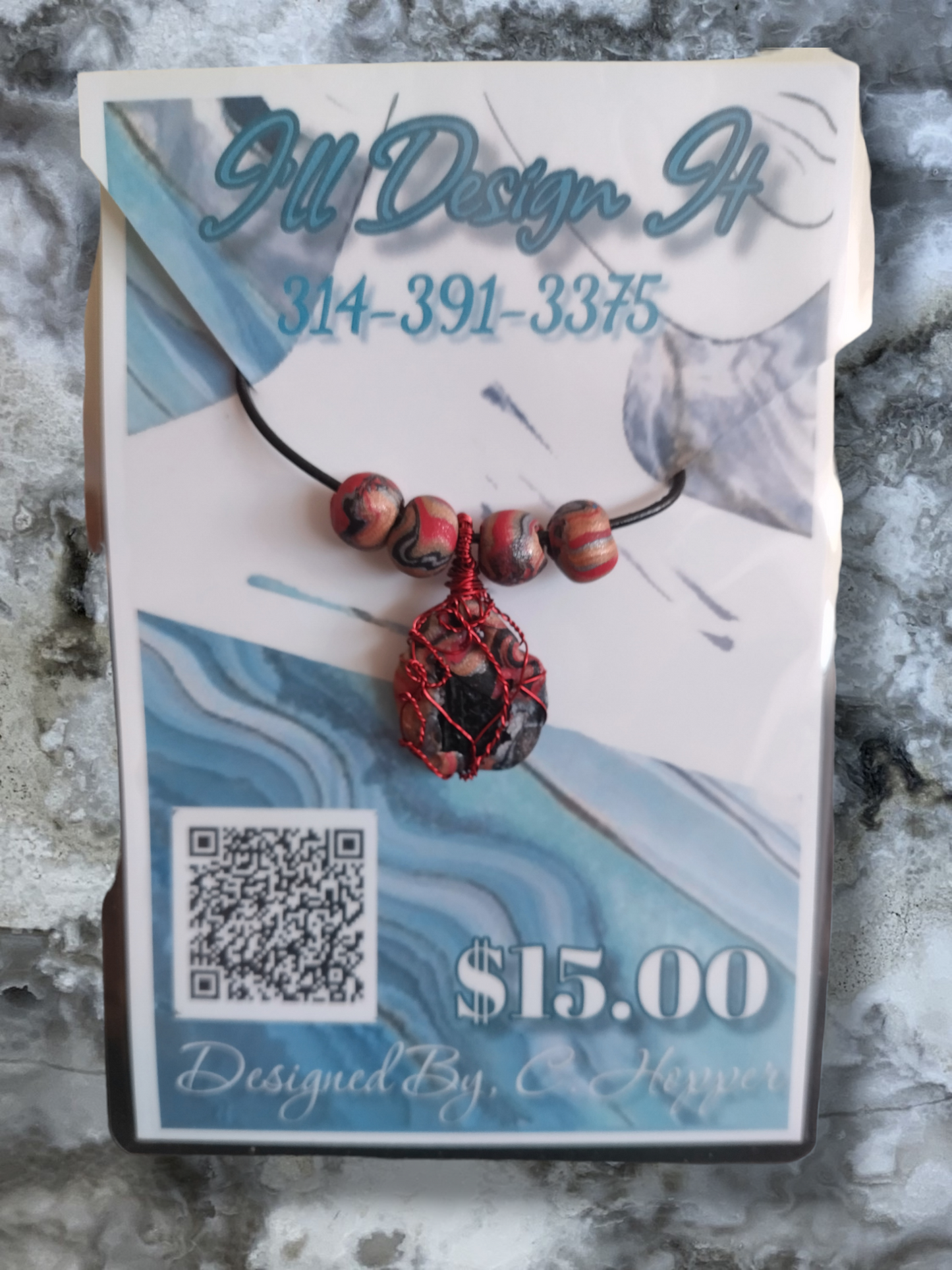 Black tourmaline in a clay pendant on an adjustable leather cord necklace.