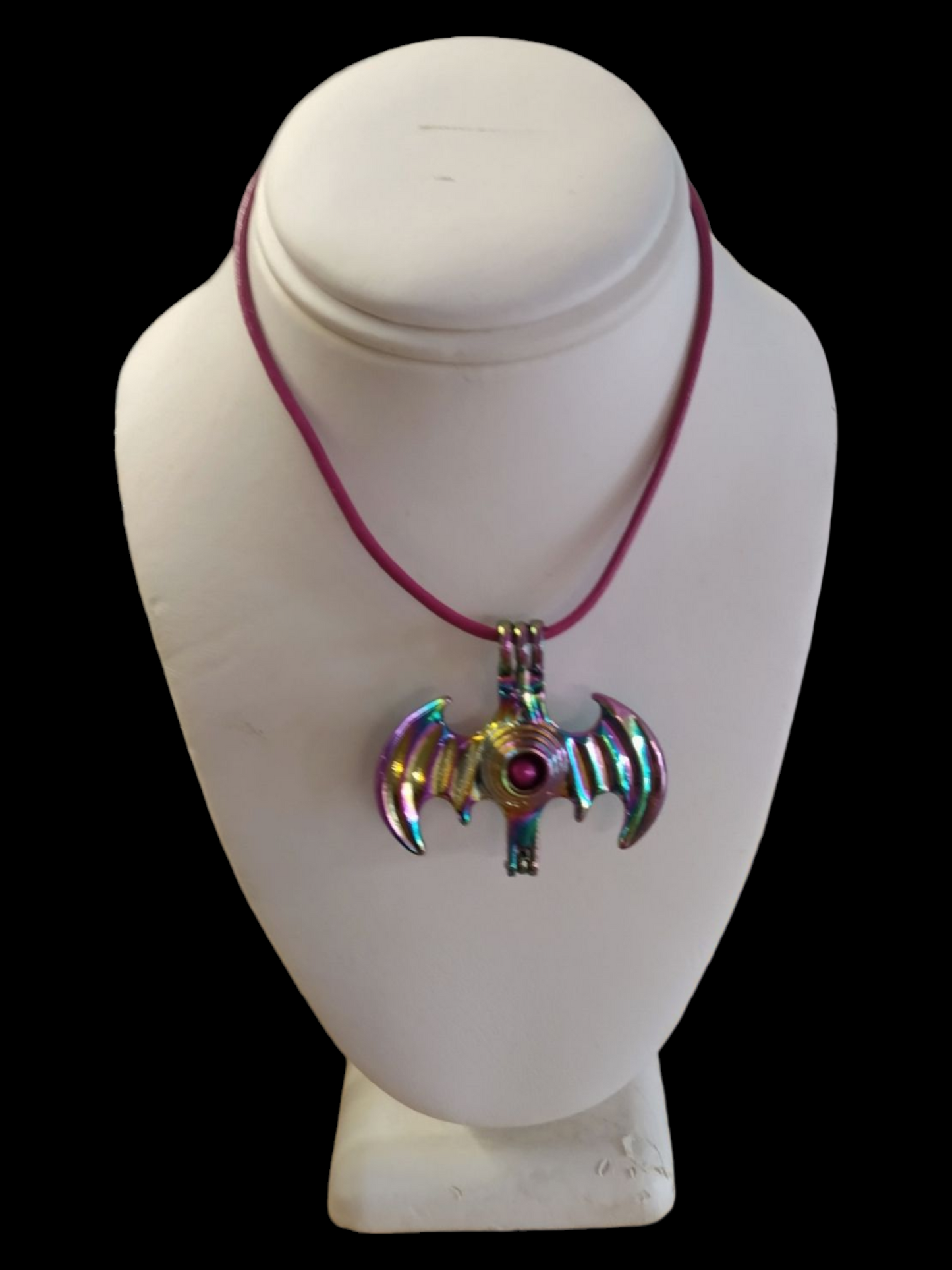 Batman cage with hot pink pearl necklace