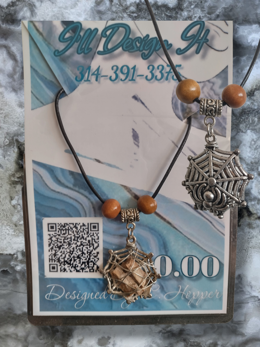 Petrified wood in a spider web on an adjustable leather cord necklace.