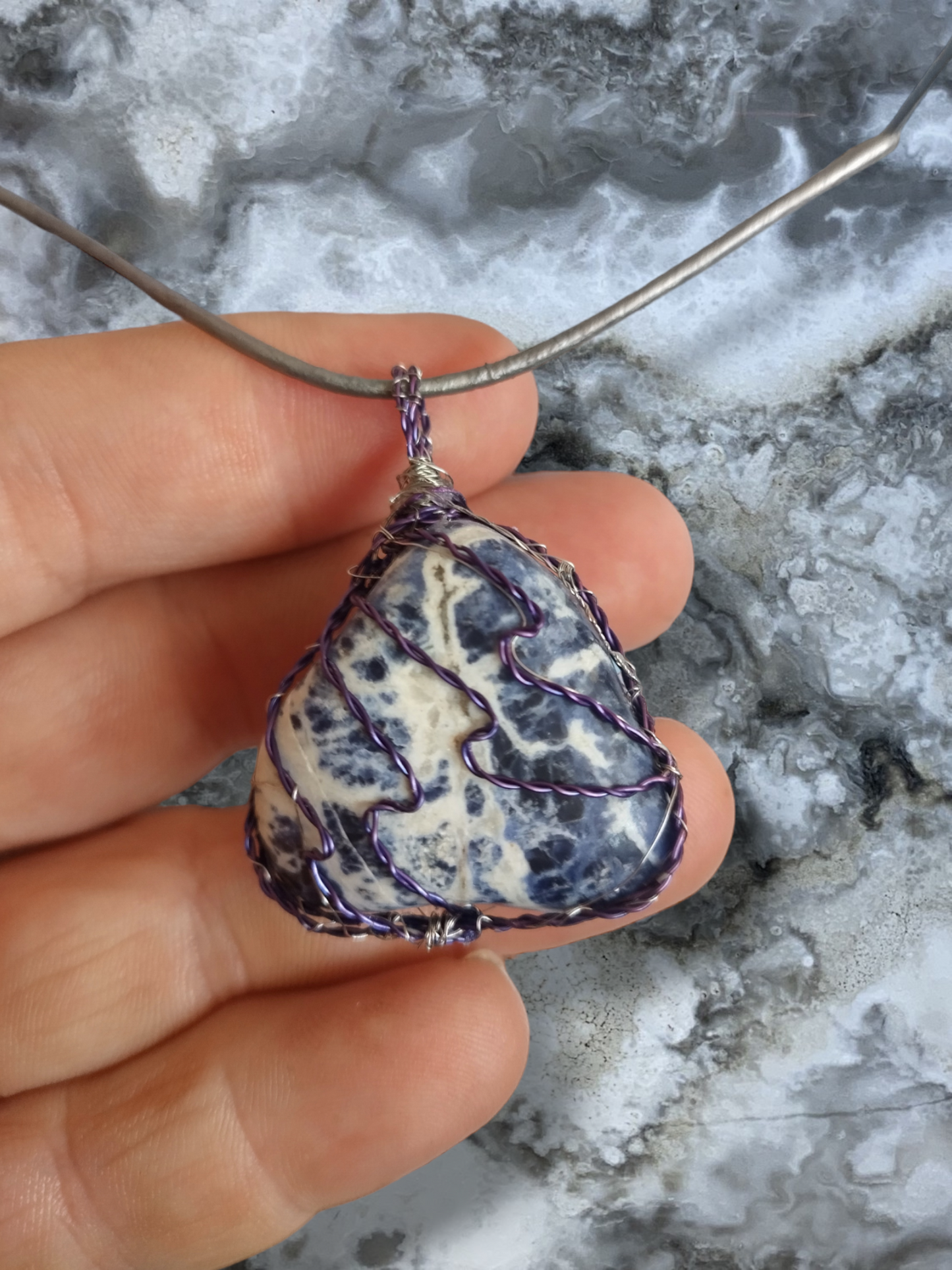 Sodalite pendant wire wrapped on a adjustable leather cord