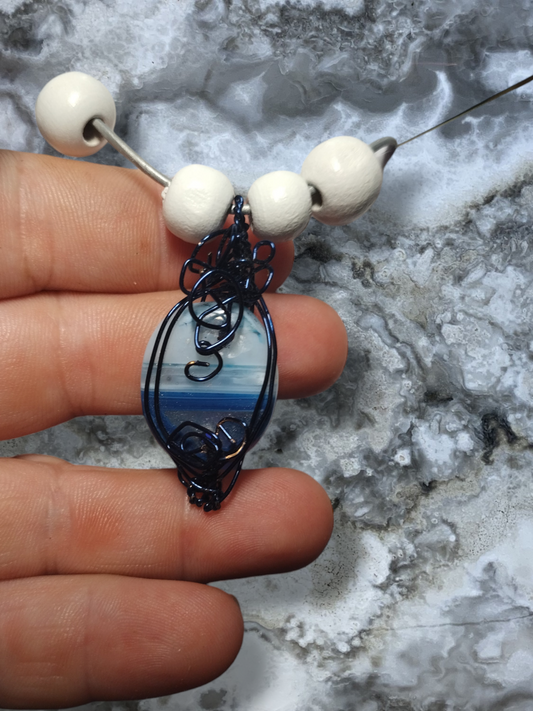 Wired wrapped dyed agate pendant on an adjustable leather cord necklace