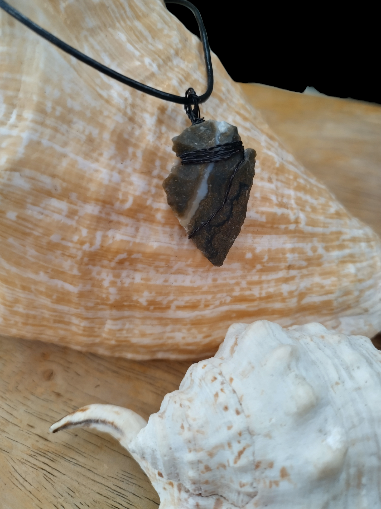 Hand wired wrapped agate head arrowhead necklace with adjustable leather cord necklace.