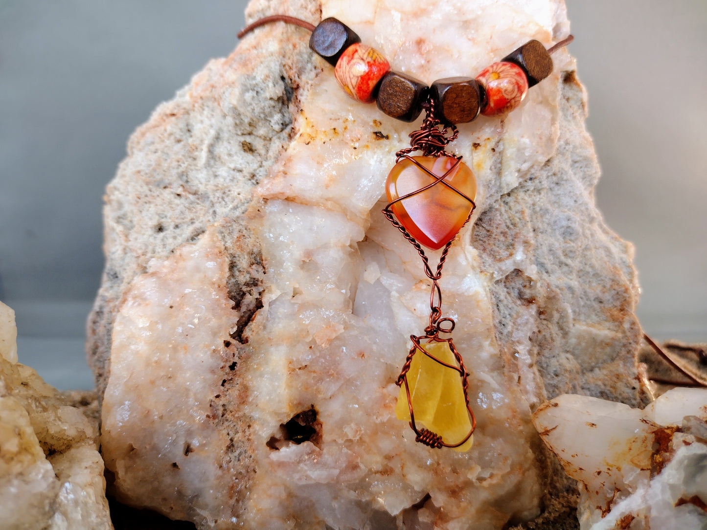 Necklace with hand wired carnelian heart pendant.