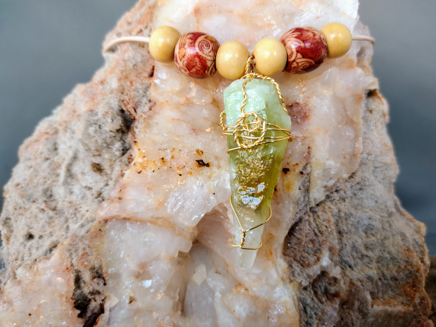 Hand wire wrap necklace with green calcite pendant.