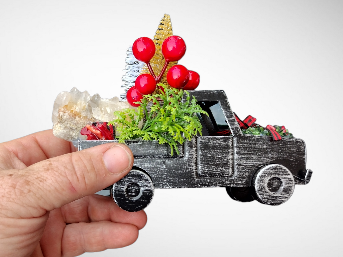 Metal truck and sled with quartz decor.